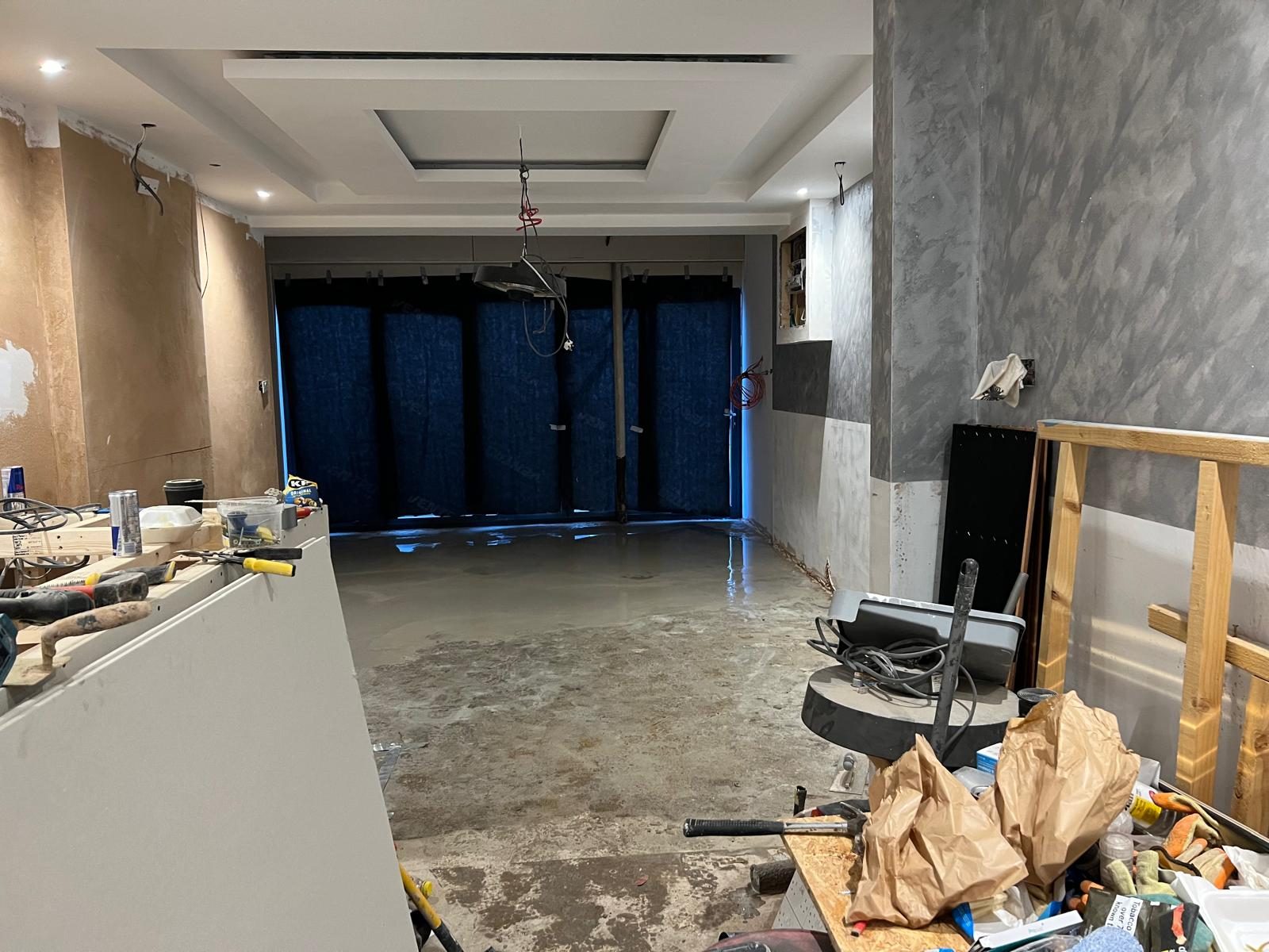 Concrete floor installation during property improvement works