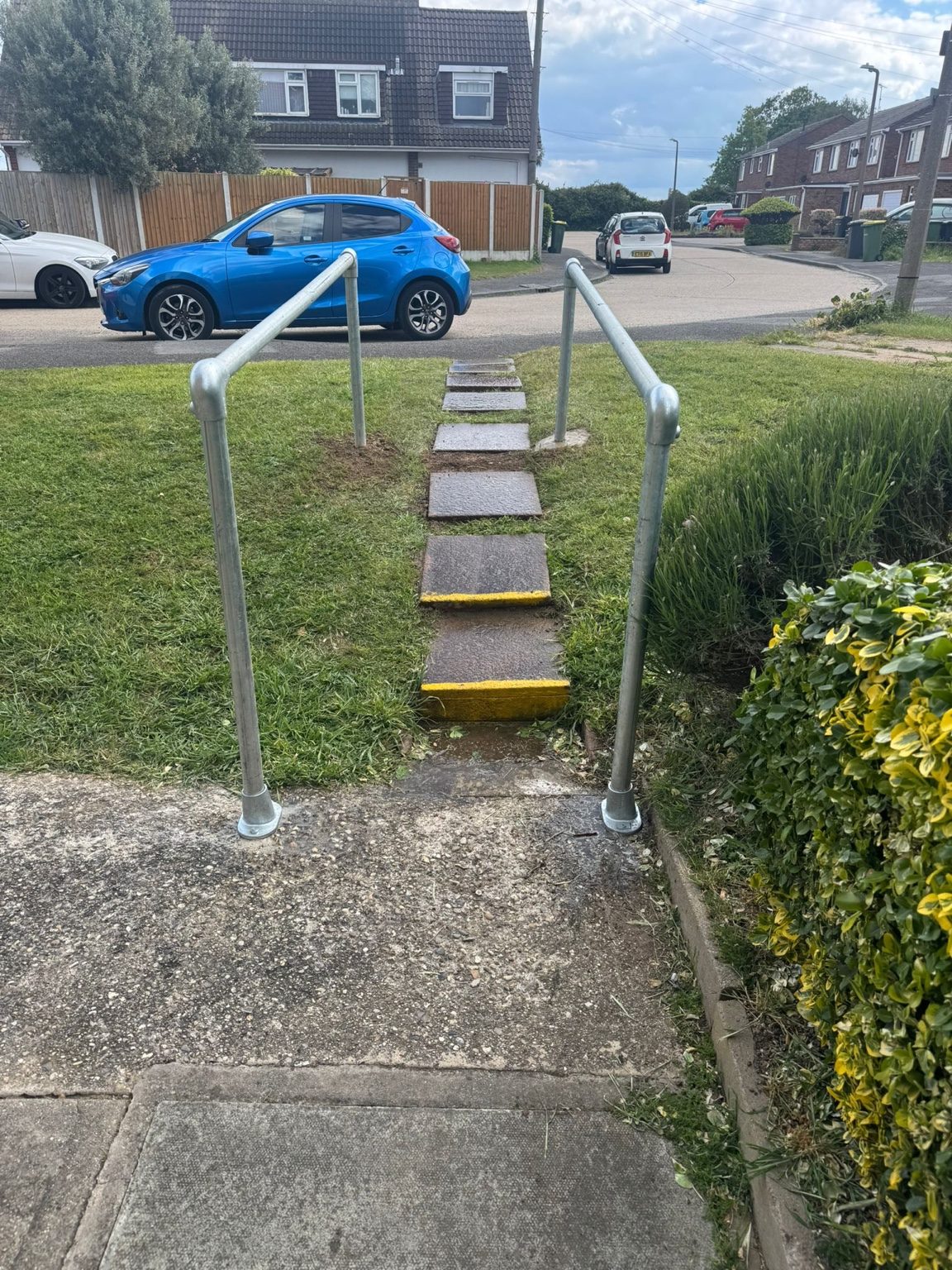 Concrete access path with new metal handrails