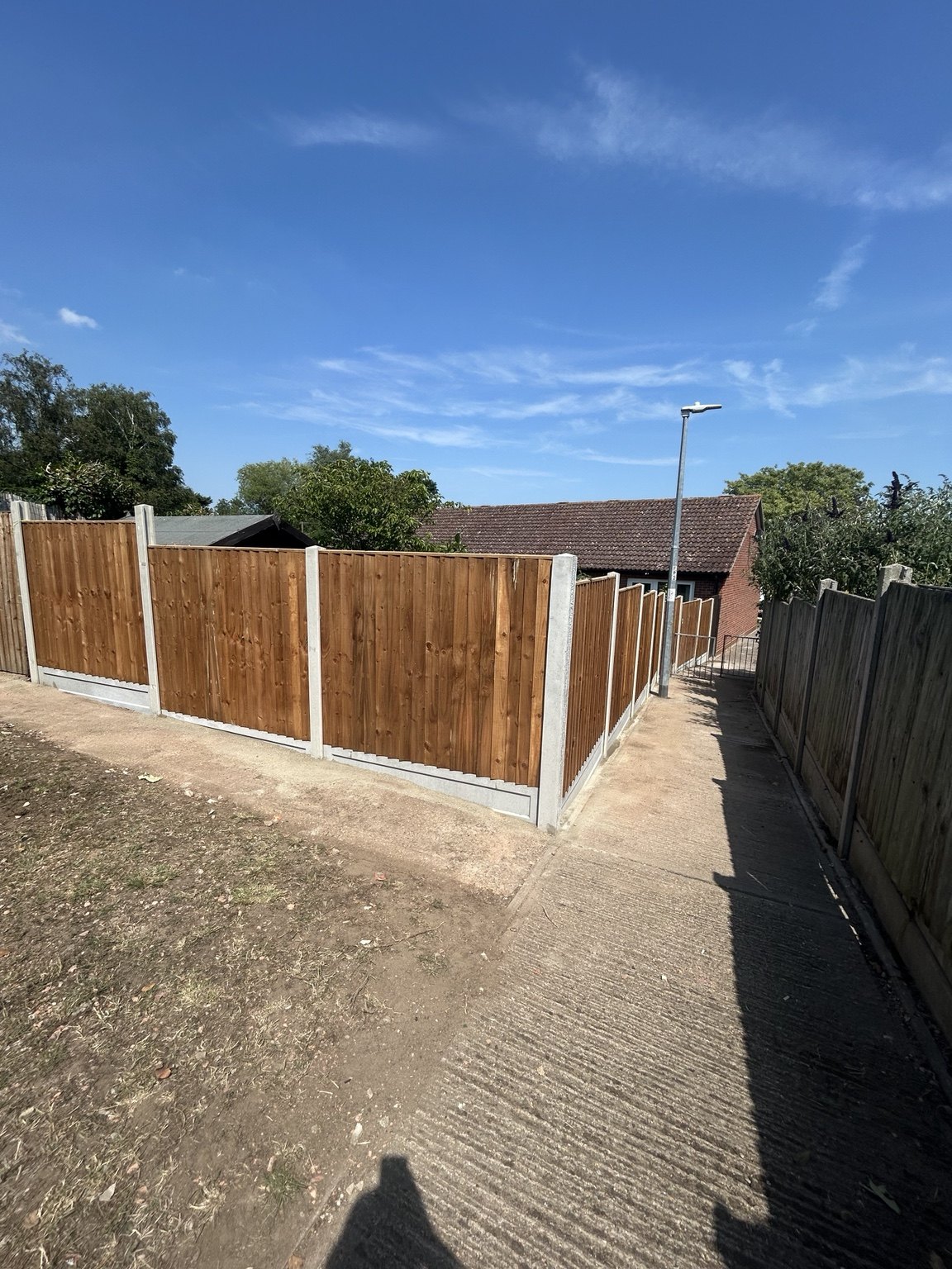 Completed timber fencing with concrete posts and gravel board