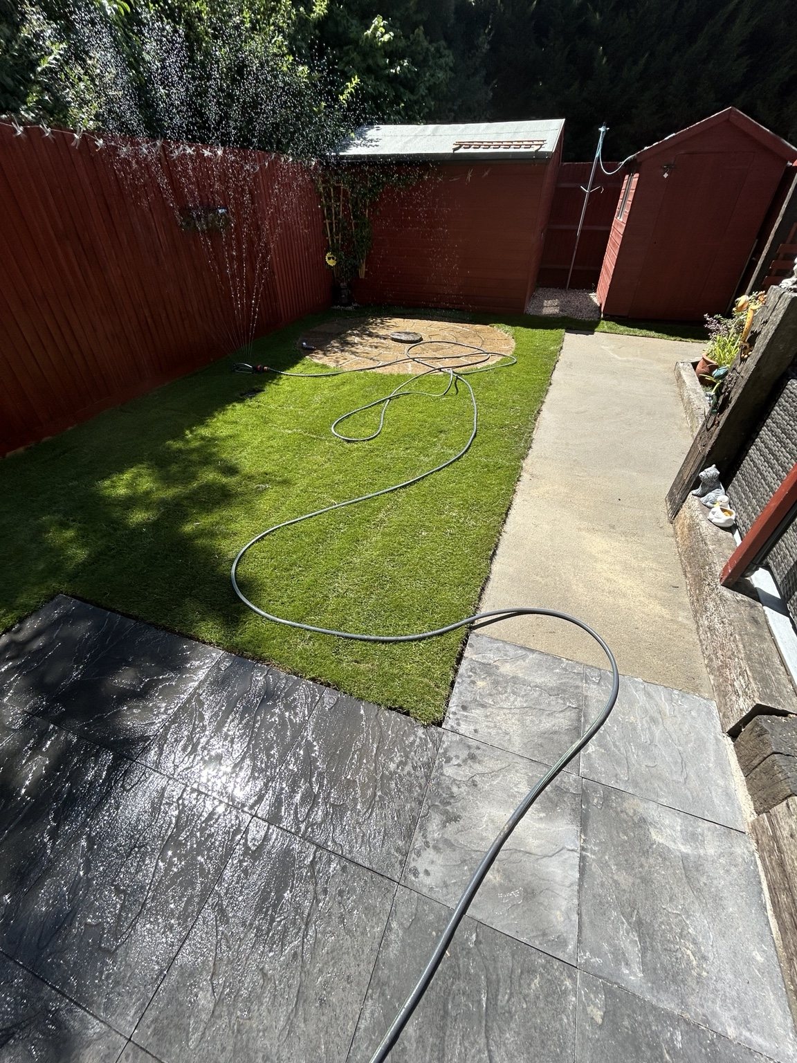 Garden landscaping with fencing and paving